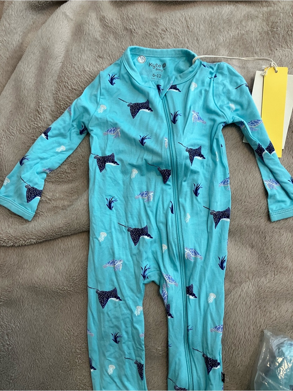 Kyte Baby Teal Narwhal Print Zip One-Piece & crib sheet